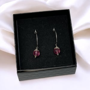 Lyserød øreringe  – produktbillede