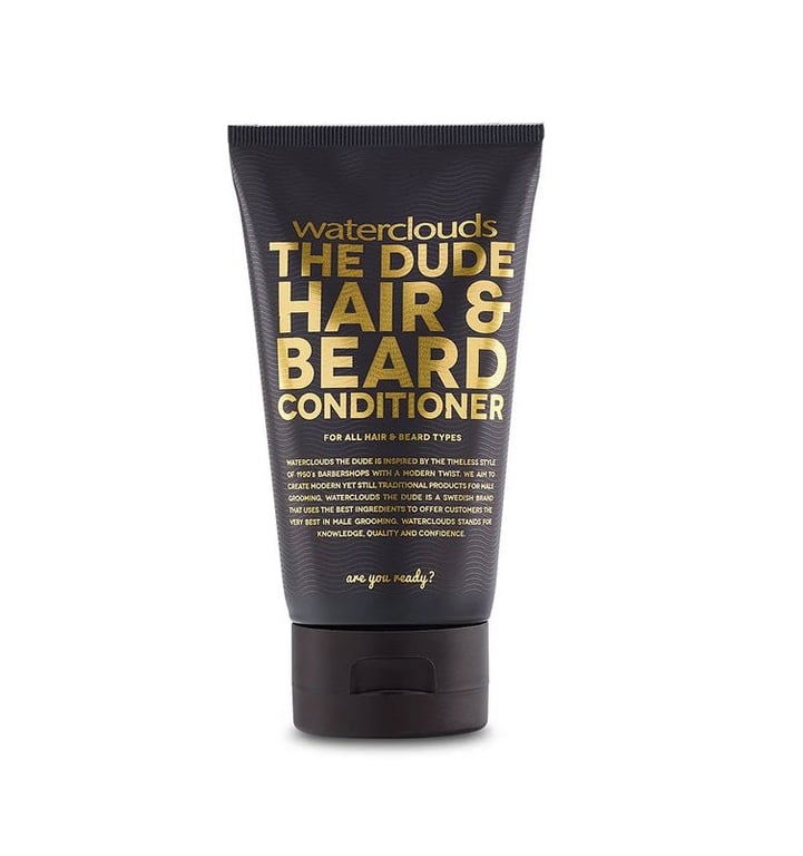 Sort tube med guldtekst, mærket "waterclouds THE DUDE HAIR & BEARD CONDITIONER" til hår og skæg.