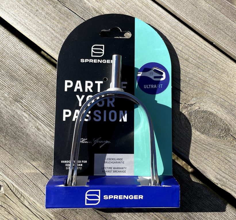 Stålgrimmestrigle fra Sprenger i original emballage med teksten "Part of your passion" og "Lifetime warranty against breakage."