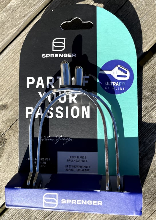 Billede af et par ultralette, smalle Sprenger sporer i original emballage med teksten "Part of your passion" og "Lifetime warranty against breakage".