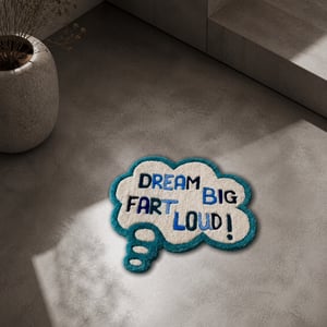 "Dream big fart loud" tuftet tæppe.  – produktbillede
