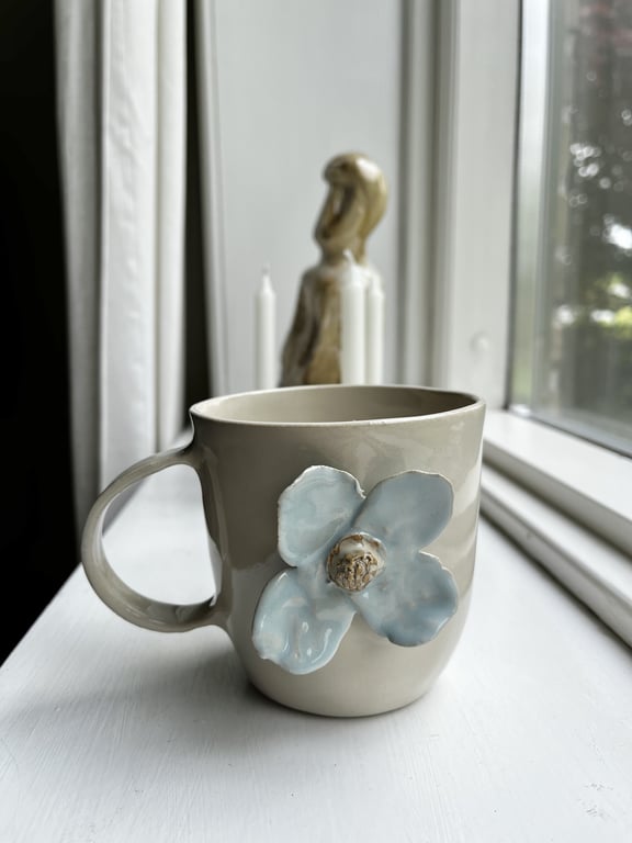 Lyseblå blomsterkop