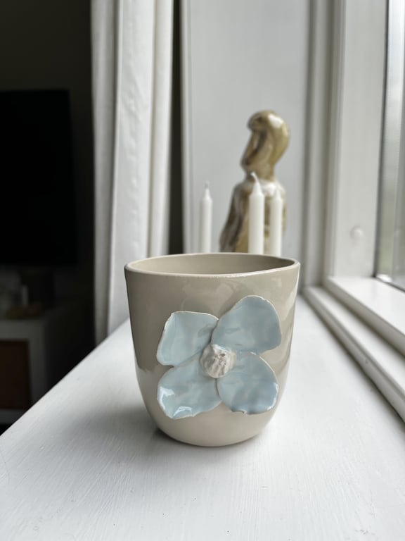 Lyseblå blomsterkop