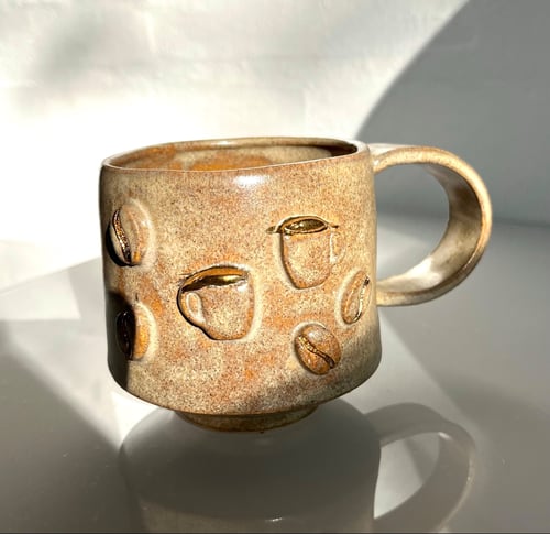 Kop med guld detaljer (1)