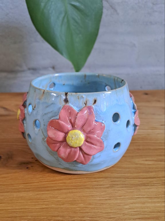 Fyrfadsstage med blomster