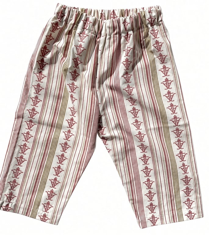Bukser i beige med røde og brune lodrette striber og mønstre, elastisk talje.