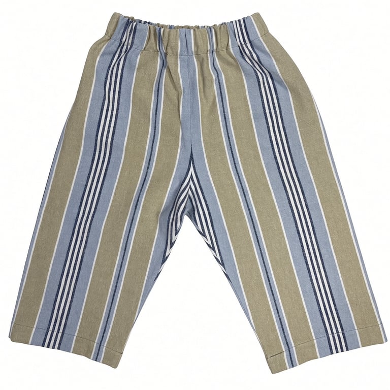 Billede af et par bukser til børn med lodrette striber i blå, beige og hvide farver.