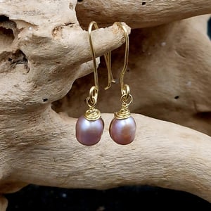 Rosa ørekroge. – produktbillede