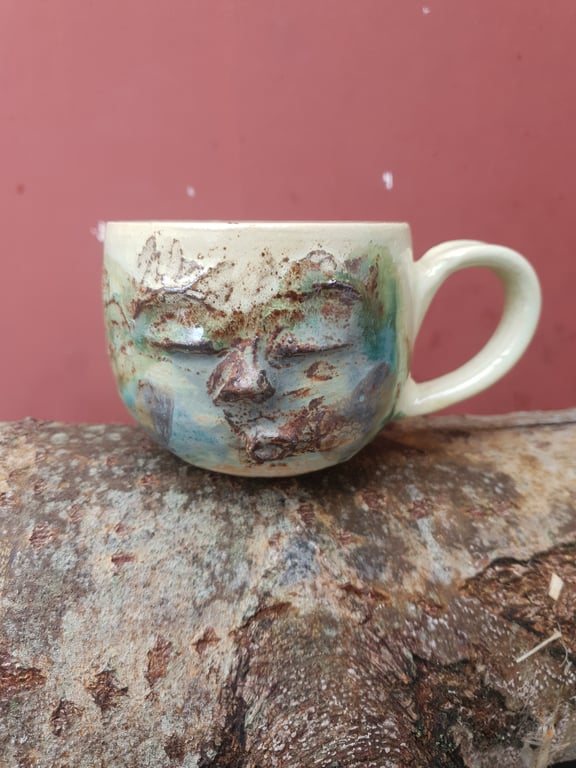 Syngende ansigtskop med hank 