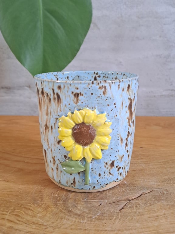 Solsikke koppen kan indeholde 350 ml.