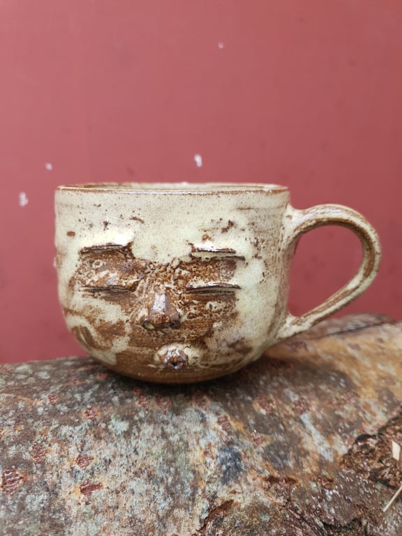 Kyssende ansigtskop med hank 