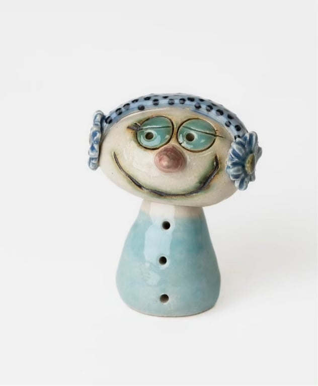 Vinterpige m hørebøffer m blomster