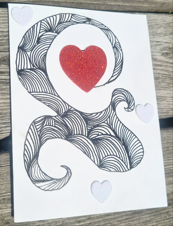 Stort kort med Doodles og hjerter. 