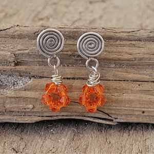 Orange krystal øretikker. – produktbillede