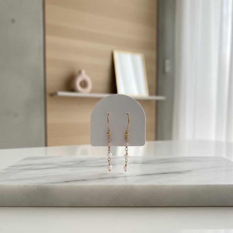 Gyldne sølv øreringe med facetslibet Rosa Quartz 