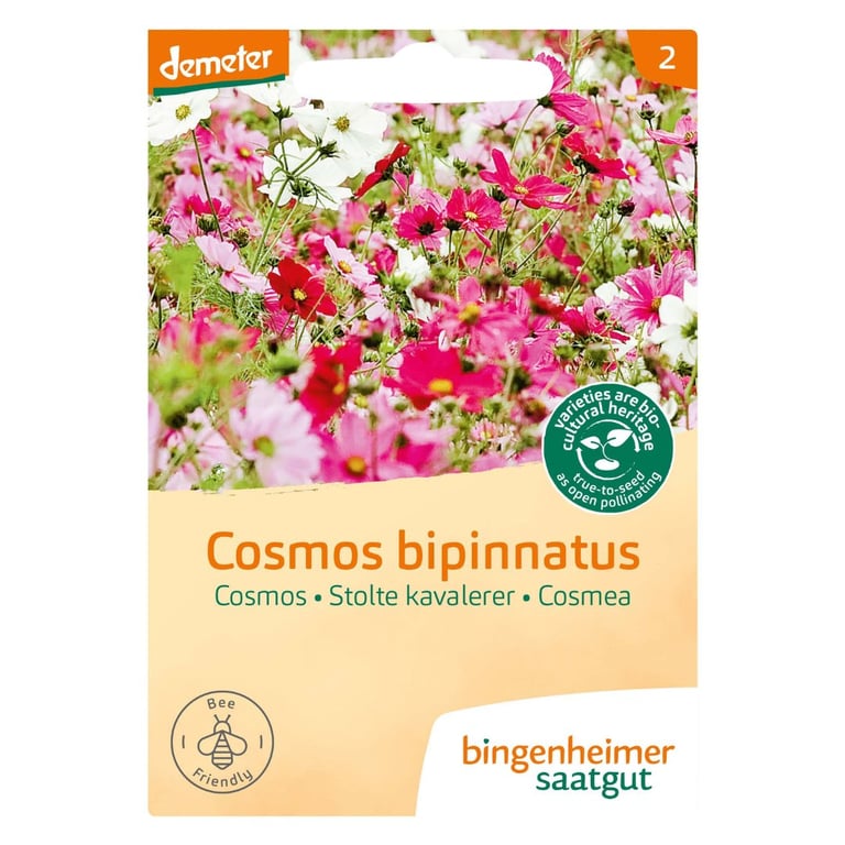 Frøpose med billeder af rosa og hvide Cosmos bipinnatus blomster, mærket "demeter" og "bingenheimer saatgut" med tekst på dansk, der beskriver blomsten som Stolte kavalerer.