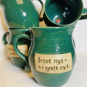 Keramik krus med tekst - Intet nyt er godt nyt – produktbillede