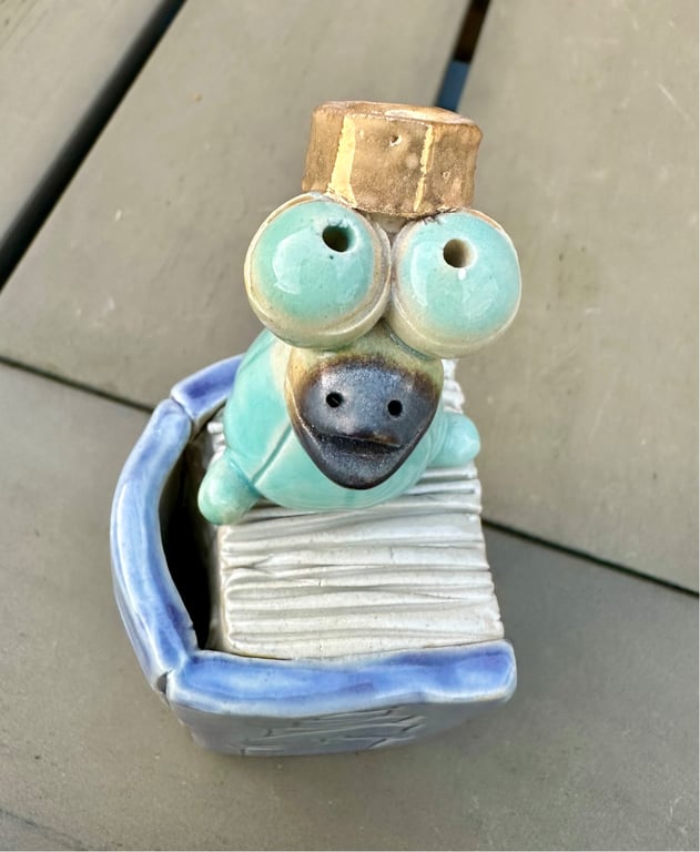 Læsefugl m lilla bog og ægte guld