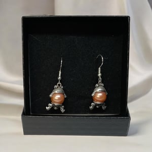 Lyserød øreringe  – produktbillede