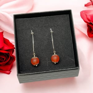 Røde øreringe  – produktbillede