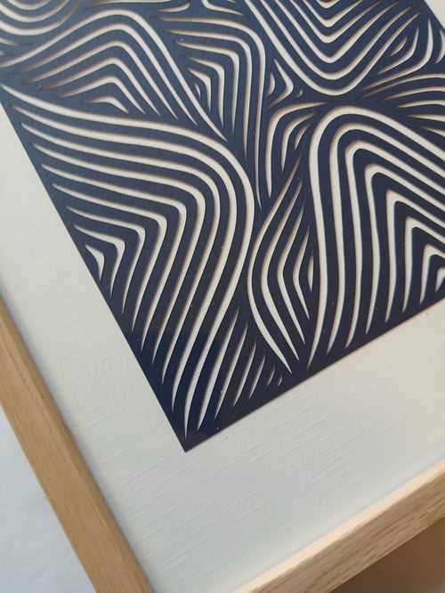 A4 papercut, indrammet 