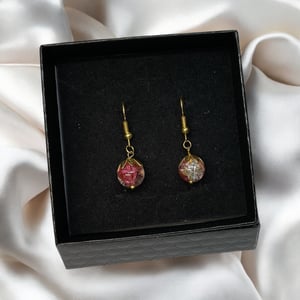 Lyserød øreringe  – produktbillede