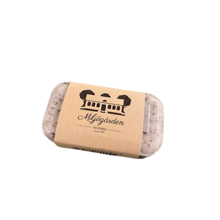 Sæbe i genanvendelig emballage med logoet af et træ og en bygning, mærket "Miljögården Sweden".